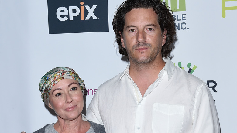 Shannen Doherty and Kurt Iswarienko posing