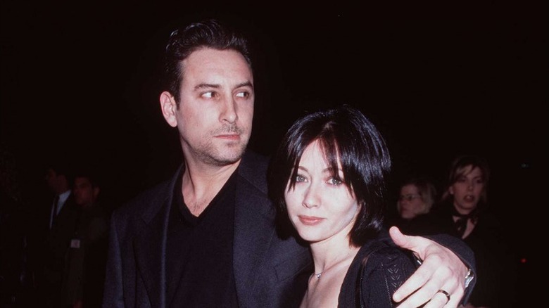 Rob Weiss and Shannen Doherty posing