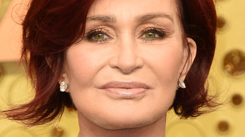 Sharon Osbourne poses in reddish hair