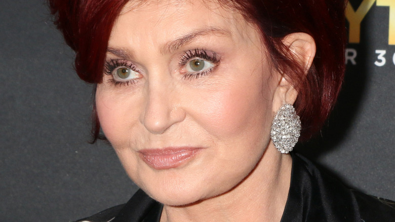 Sharon Osbourne wearing disc earring