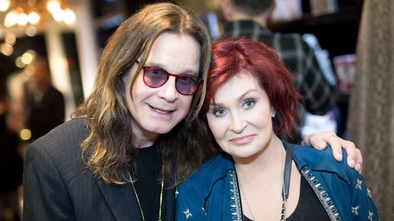 Ozzy Osbourne and Sharon Osbourne posing for a photo