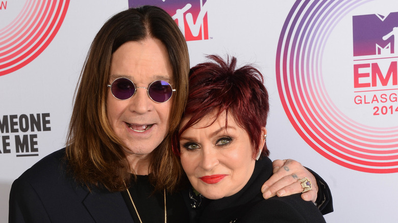 Ozzy Osbourne and Sharon Osbourne posing for a photo on the red carpet