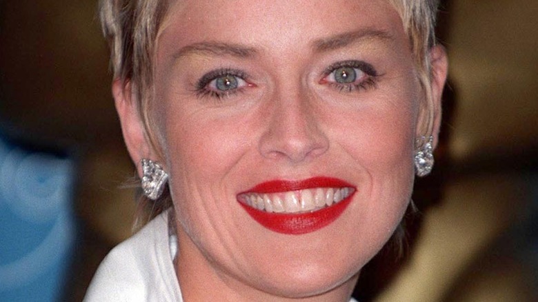 Sharon Stone smiles in red lipstick