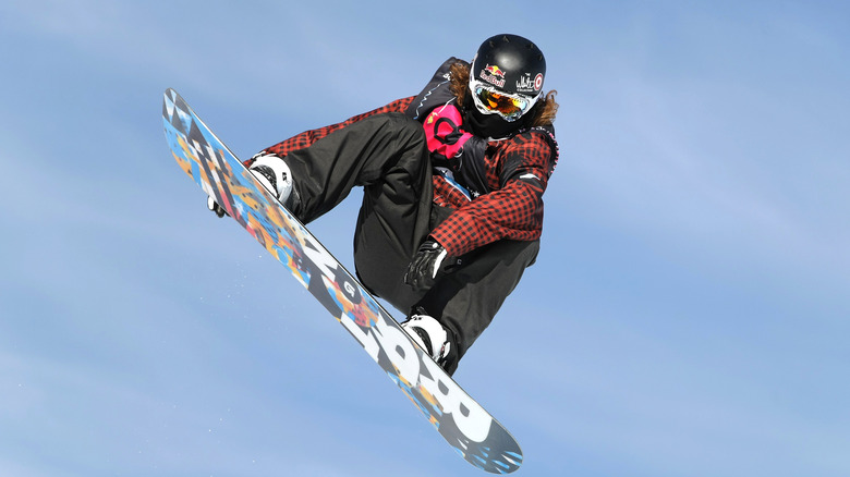 Shaun White performs a trick on the snowboard