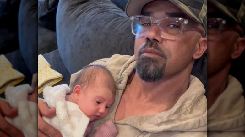 Shemar Moore holding daughter