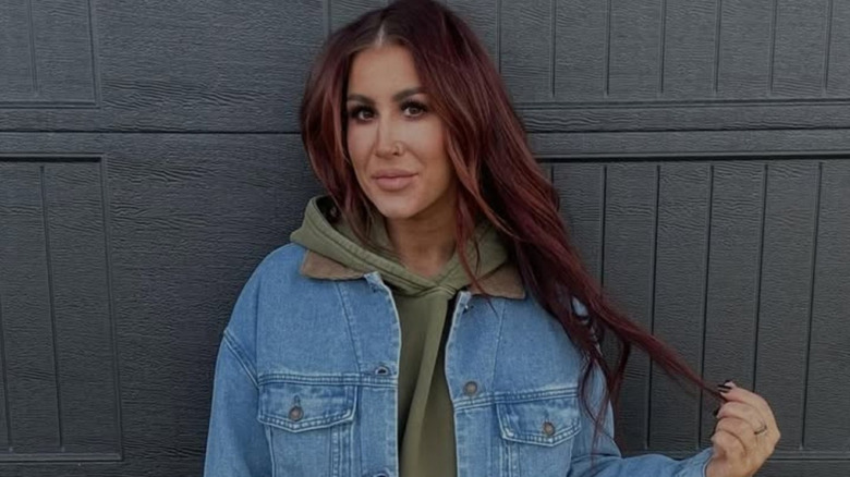 Chelsea DeBoer poses in front of door