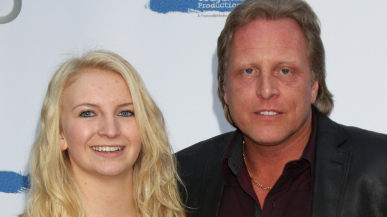 Mandy Hansen and Sig Hansen smiling at a red carpet event 