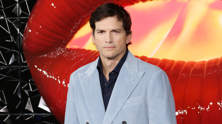 Ashton Kutcher posing with a serious face.