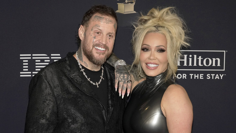 Bunnie Xo and Jelly Roll smiling while posing at an event together