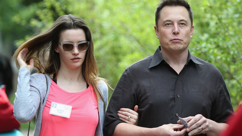 Elon Musk and Talulah Riley walking