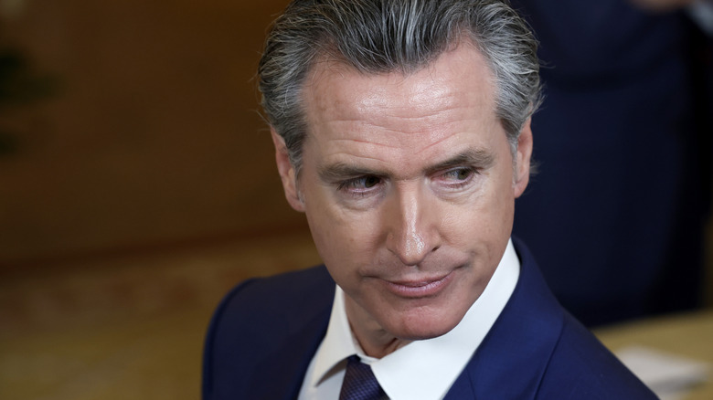 Gavin Newsom looking over his shoulder during a meeting with other governors at the White House.