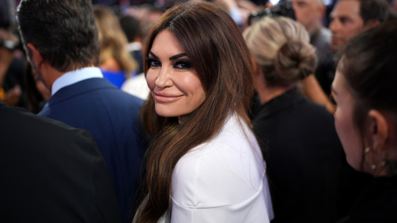 Kimberly Guilfoyle glancing over her shoulder at photographers at the 2024 RNC.