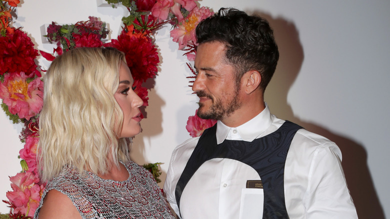 Katy Perry and Orlando Bloom look at each other