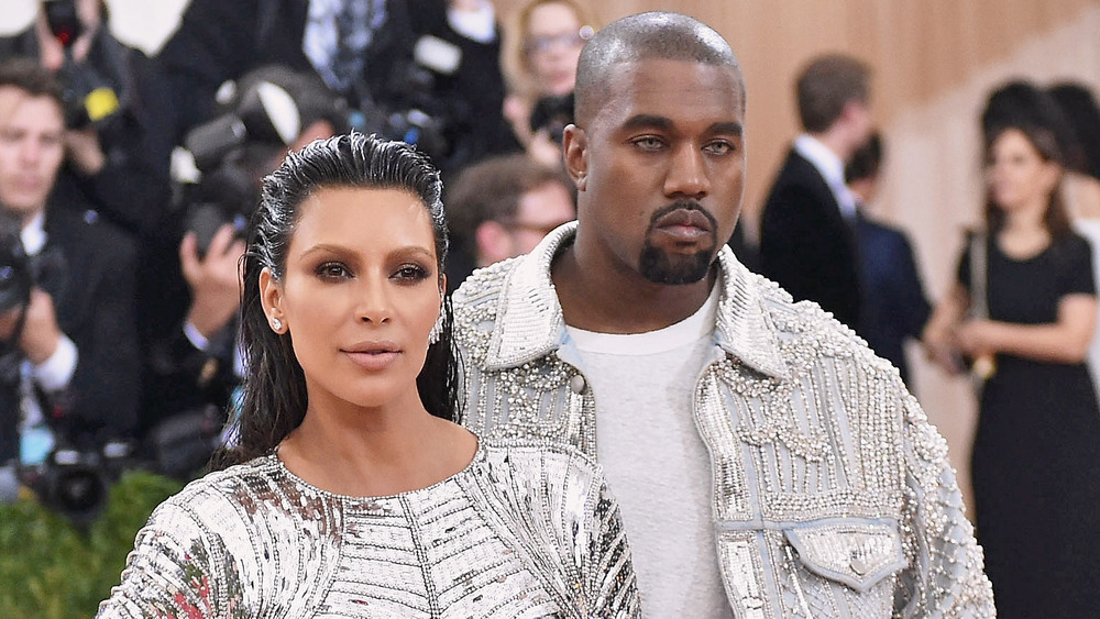 Kim Kardashian and Kanye West at the wearing matching metallic at the MET Gala 