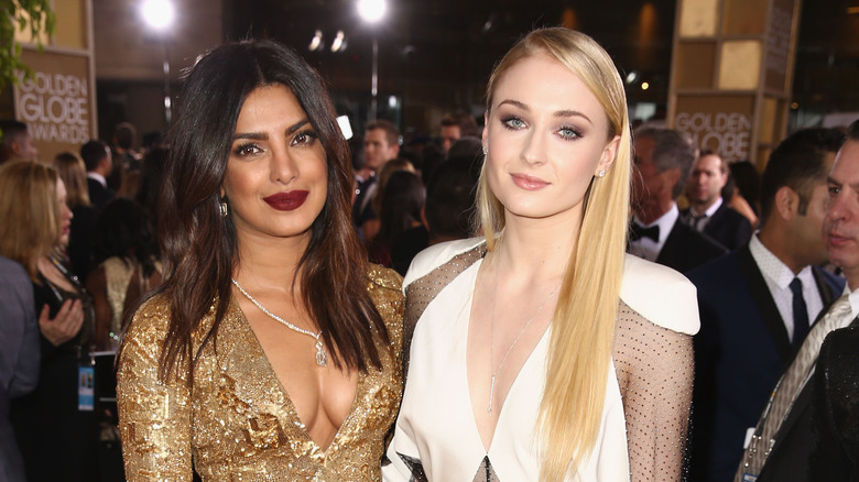 Priyanka Chopra and Sophie Turner smiling
