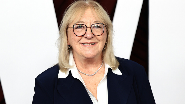 Donna Kelce wearing glasses and posing