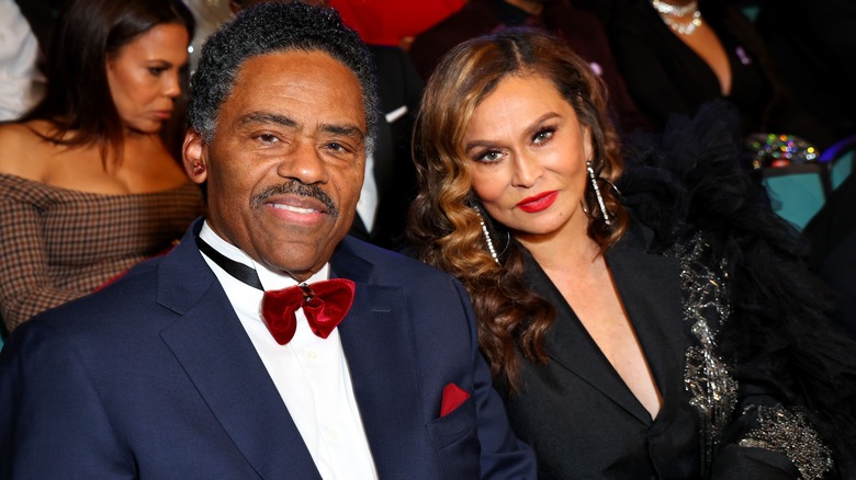Richard Lawson and Tina Knowles smile 