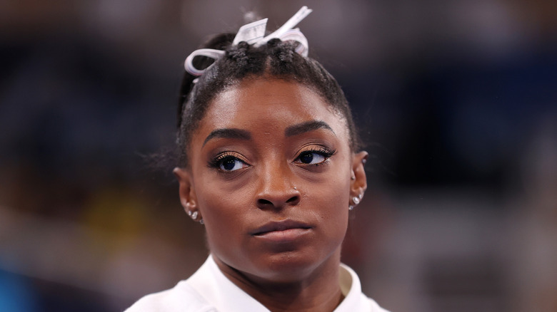 Simone Biles with a serious expression on her face