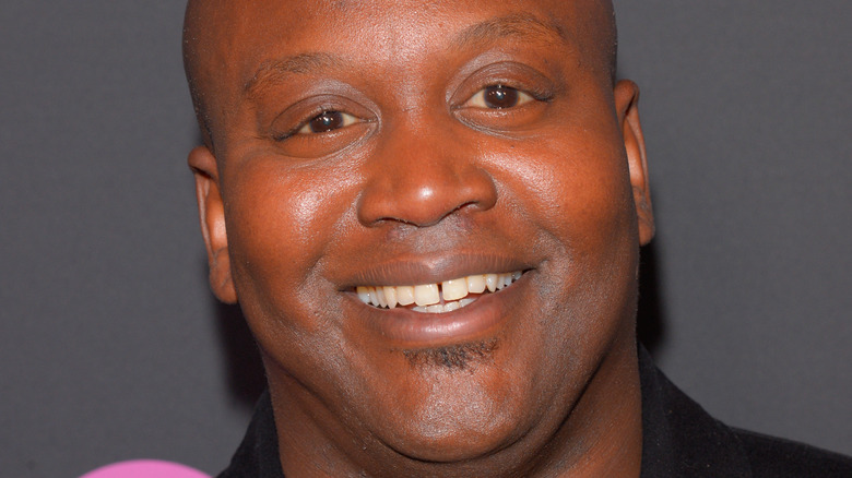 Tituss Burgess smiles at an event