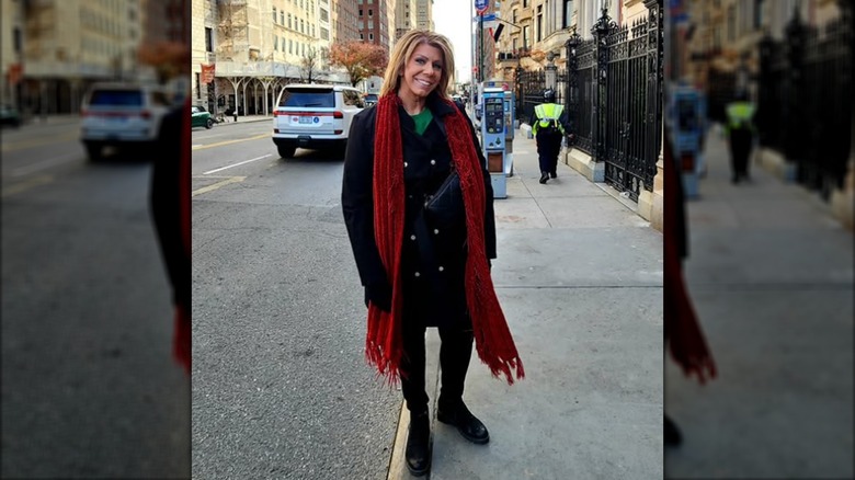 Meri Brown posing on a trip.