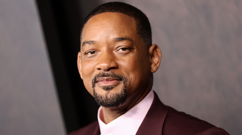 Will Smith slightly smiling at camera