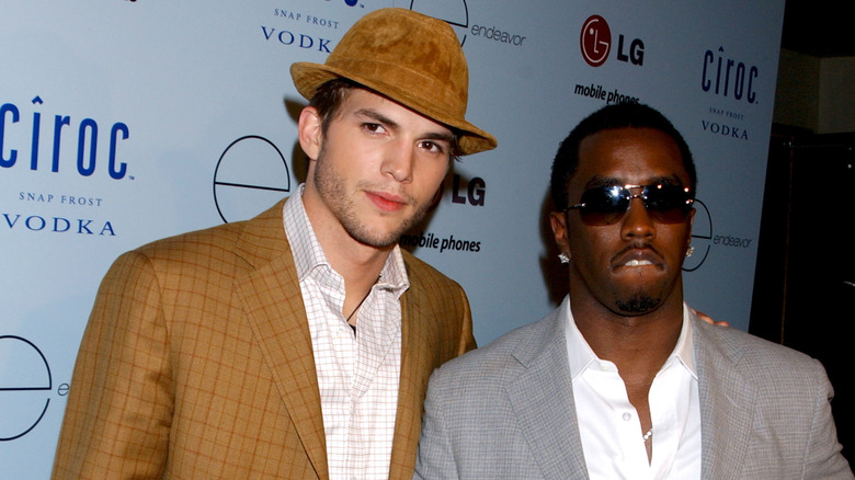 Ashton Kutcher brown hat Diddy gray suit