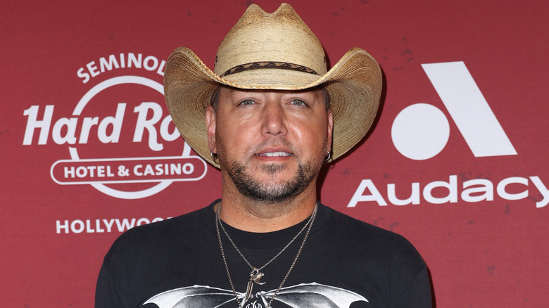 Jason Aldean posing in cowboy hat