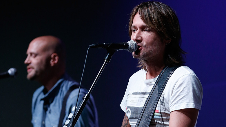 Keith Urban and Jerry Flowers perform
