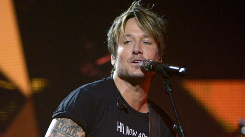Keith Urban arm and wrist Nicole tattoos