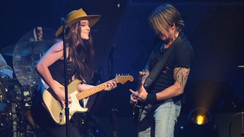 Keith Urban performs with Maggie Baugh