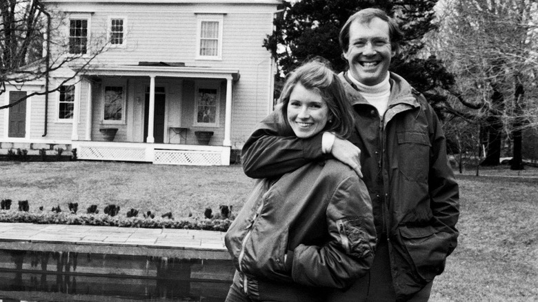 Black and white photo of a young Martha Stewart and her ex-husband Andrew Stewart outside their home
