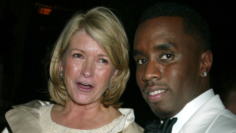 Martha Stewart and Puff Daddy posing for cameras