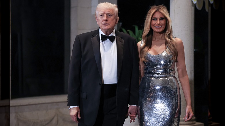 Donald Trump and Melania Trump holding hands on New Years Eve.