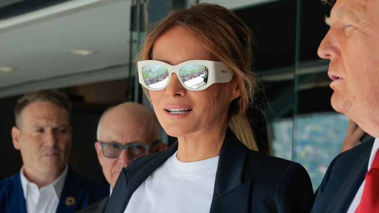Melania Trump wearing white oversized sunglasses