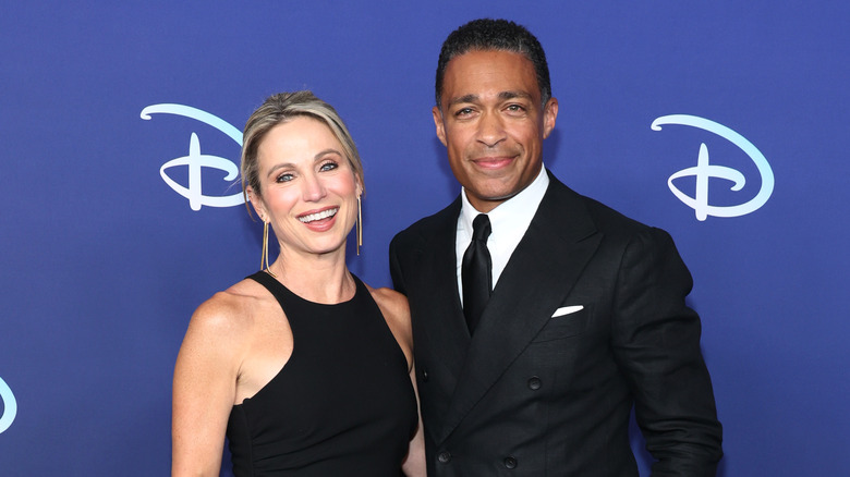 T.J. Holmes and Amy Robach pose 