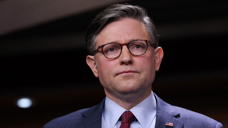 Speaker of the House Mike Johnson (R-LA) listening during a news conference on the government shutdown at the U.S. Capitol