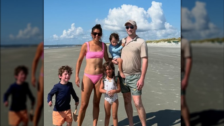 The Millers posing together on the beach.