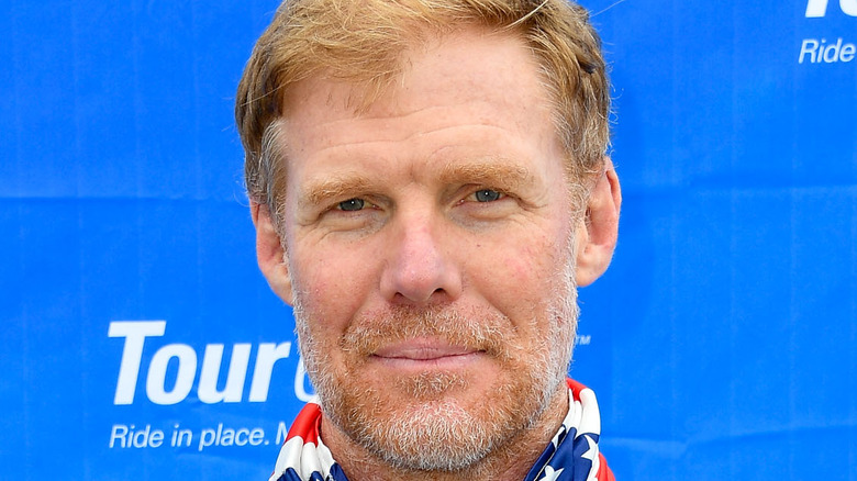 Alexi Lalas wearing the American flag around his neck