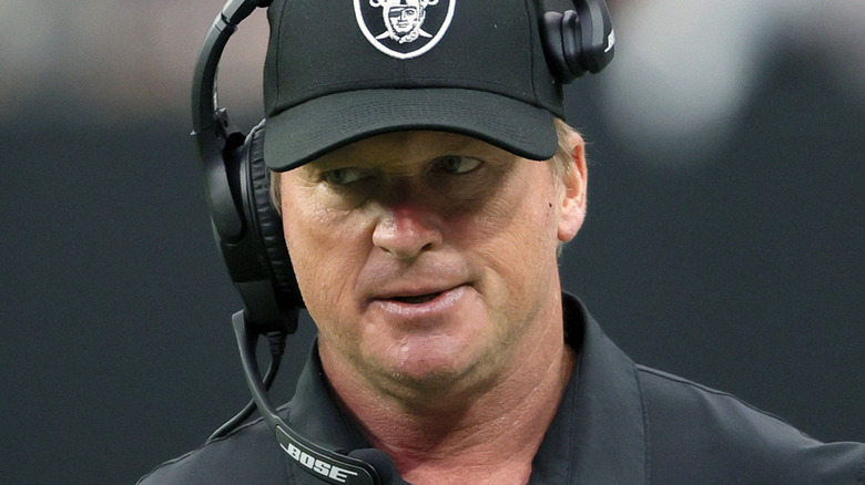 Jon Gruden wearing a headset