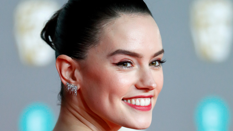 Daisy Ridley grinning