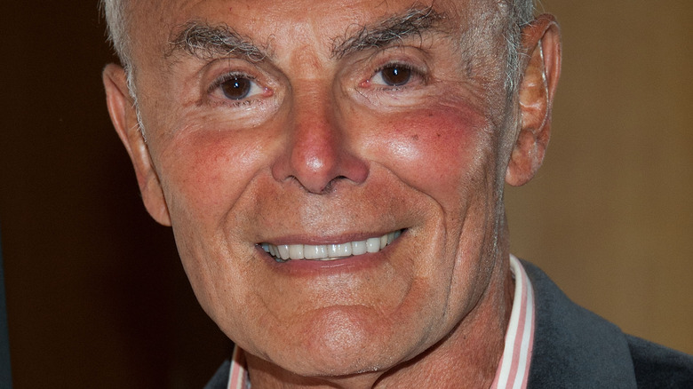 John Saxon smiles