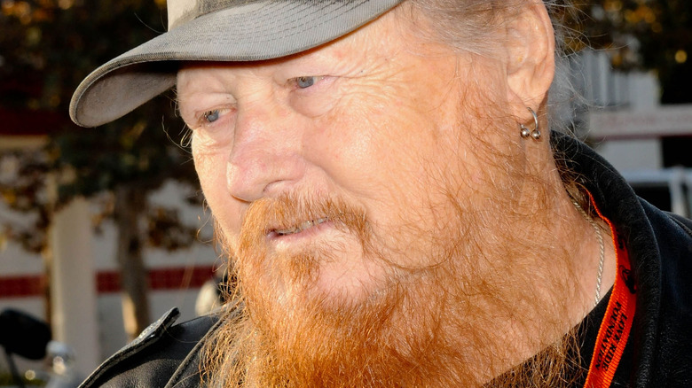 Mickey Jones wearing hat