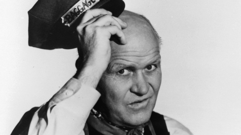 Rude Davis posing with a hat in hand in the early 1950s.