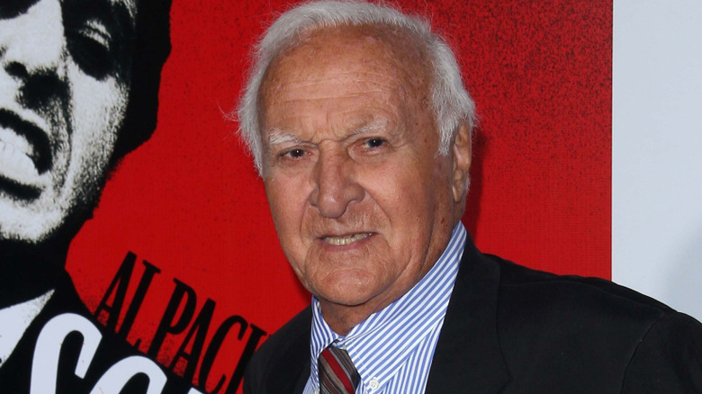 Robert Loggia, posing