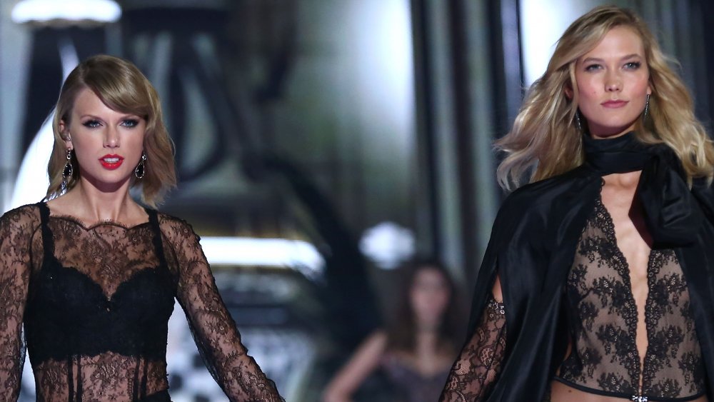 Taylor Swift, Karlie Kloss walking together at the 2014 Victoria's Secret Fashion Show