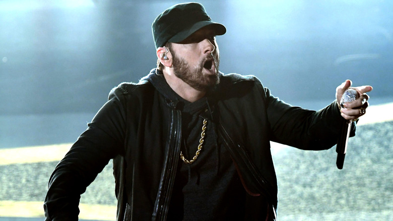 Eminem, mouth agog, on stage