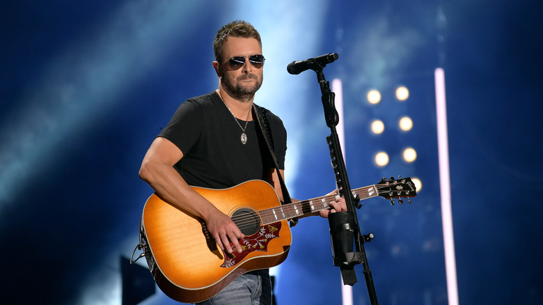 Eric Church with a guitar on stage