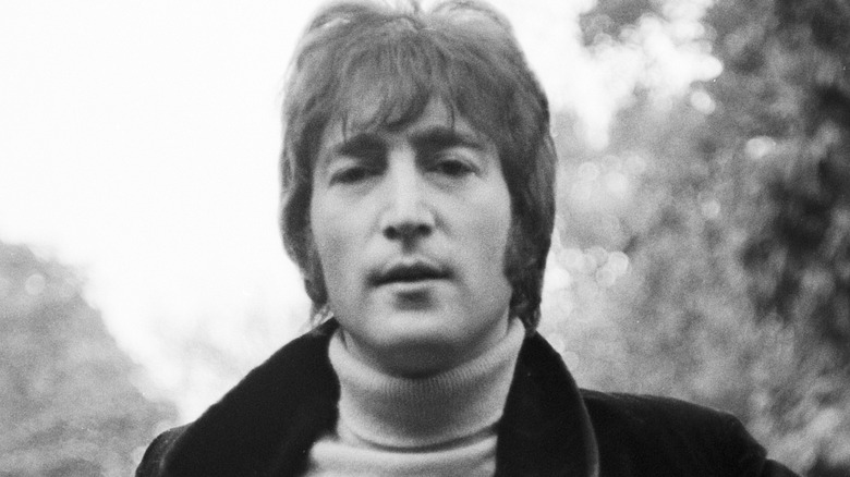 John Lennon posing