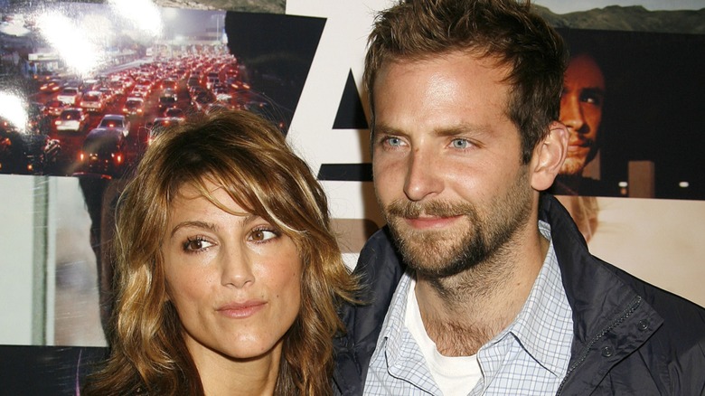 Jennifer Esposito standing next to Bradley Cooper on the red carpet
