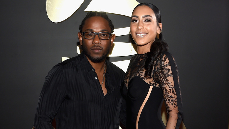 Kendrick Lamar posing with Whitney Alford